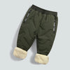 Olive green waterproof winter pants for kids with fleece lining and faux fur trim