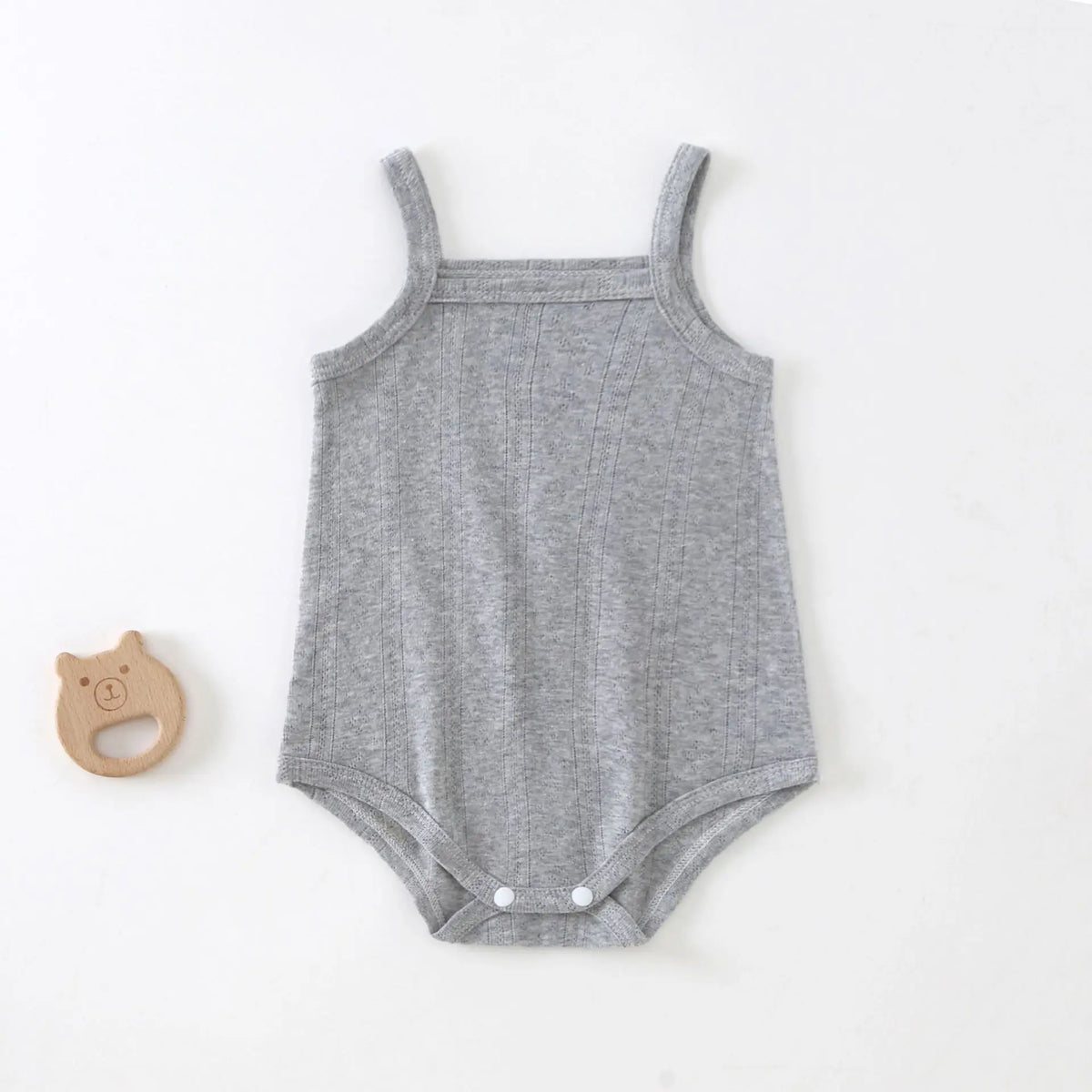 A light gray lightweight cotton strappy romper for babies lying flat on a white surface.
