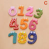 A set of wooden magnetic alphabet letters forming the numbers 0 through 9, arranged in a curved pattern.