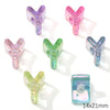 A collection of colorful acrylic alphabet beads in various shades of pink, purple, and green.