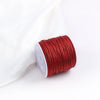 A roll of reddish-brown cotton nylon macrame cord for jewelry making and crafts.