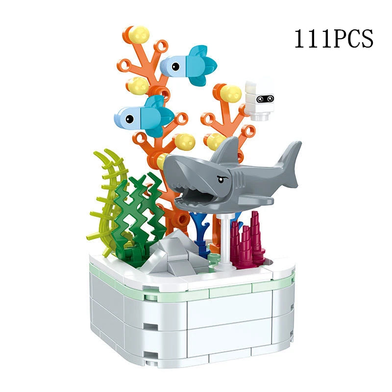 A set of 111 plastic building blocks shaped like fish and coral, arranged in a bouquet display.