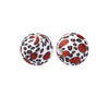 A pair of spherical silicone beads with a leopard print design featuring red leaves on a white background.