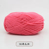 A ball of bright pink pre-dyed milk cotton yarn used for knitting and crochet.