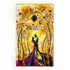 An illuminated tarot card deck featuring golden and yellow tones with figures in a forest setting.