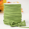 A roll of olive green velvet faux suede braided ribbon for crafting and gift wrapping.