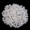 A pile of small, clear, star-shaped acrylic beads for jewelry making.
