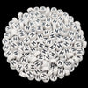 A pile of small white acrylic alphabet letter beads for jewelry making