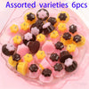 Assorted varieties of pudding-shaped resin pendants for DIY jewelry making in various colors and shapes