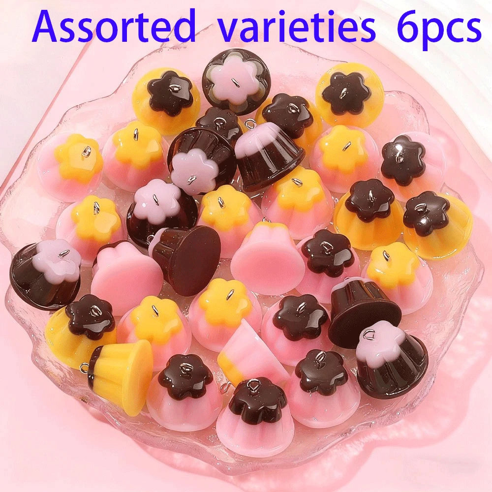 Assorted varieties of pudding-shaped resin pendants for DIY jewelry making in various colors and shapes
