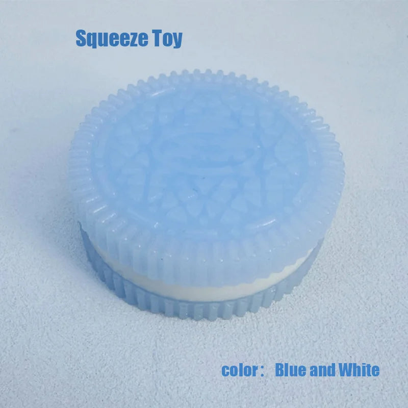 A light blue and white silicone squeeze toy with a textured surface resting on a white background.