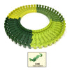 A circular puzzle made of green and yellow interlocking pieces shaped like a race track