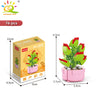 A set of 76 plastic flower succulent building blocks in pink and green colors packaged in a box.