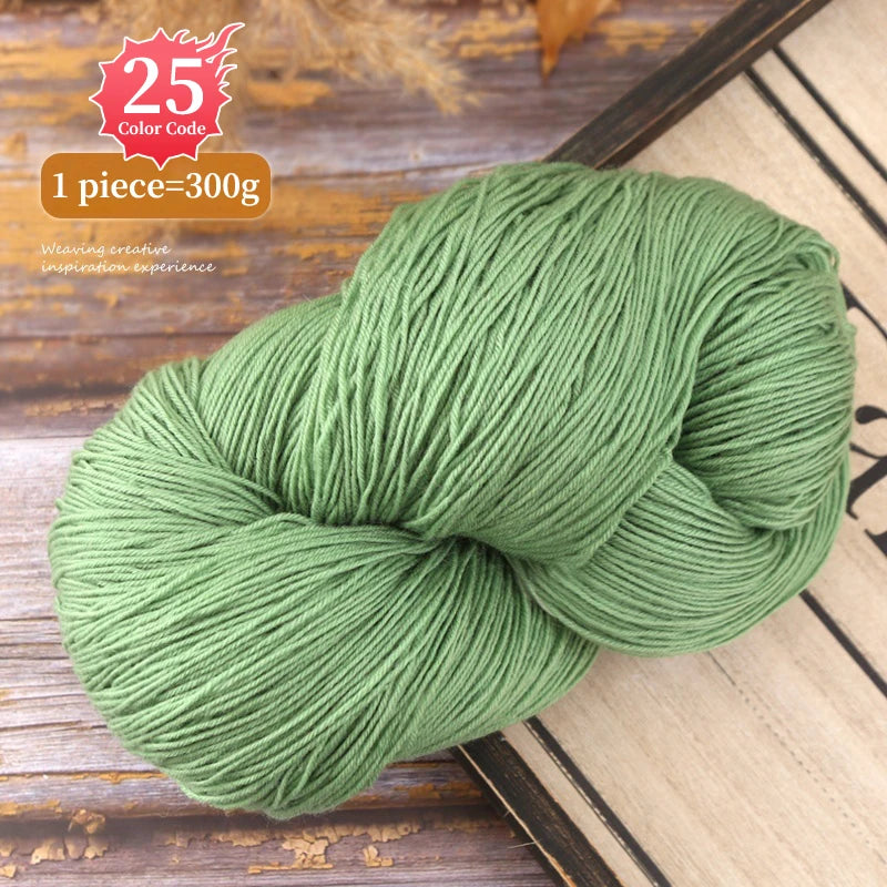 A ball of light green yarn, 300g, used for knitting or weaving projects.