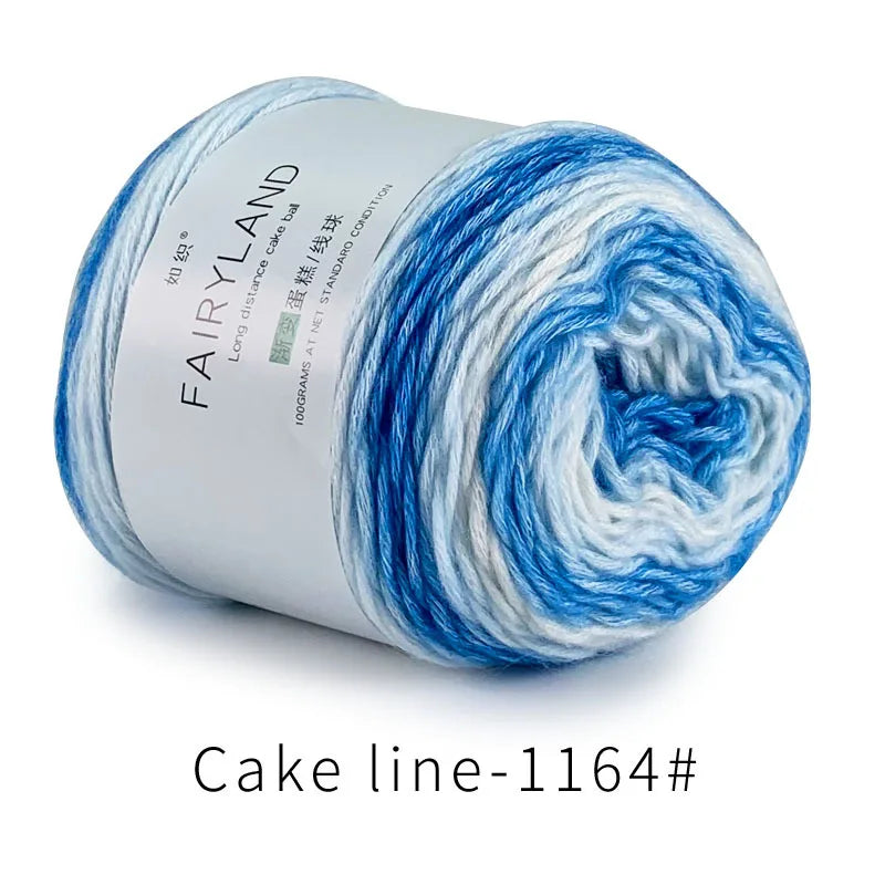 Blue and white gradient cotton-wool yarn skein labeled Fairyland Cake line 1164
