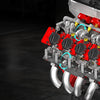 Close-up view of a detailed motorized V8 supercar engine building kit with various components and tools.