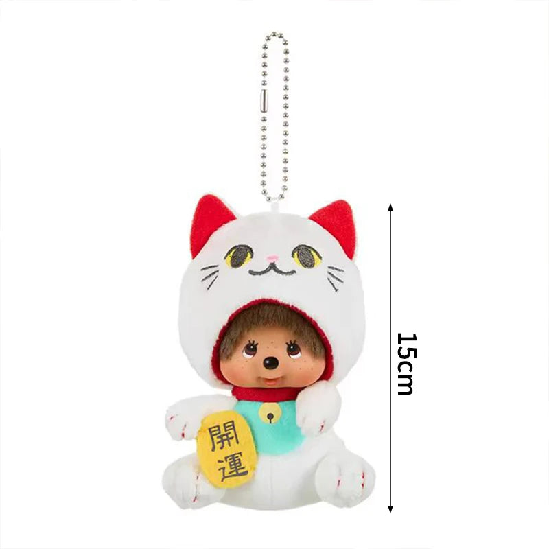 A white cat plush cartoon keychain charm with pink ears and a red nose.