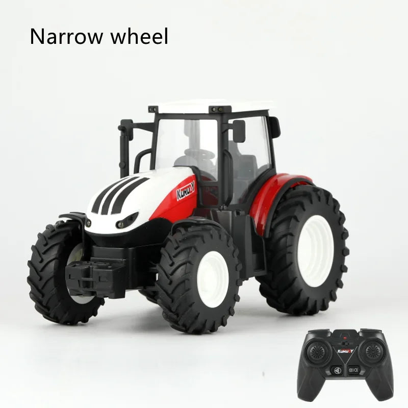 A white and red remote control tractor model with large tires is shown next to a game controller.