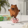 A small, detailed building block figure of a brown capybara standing on a pink base.