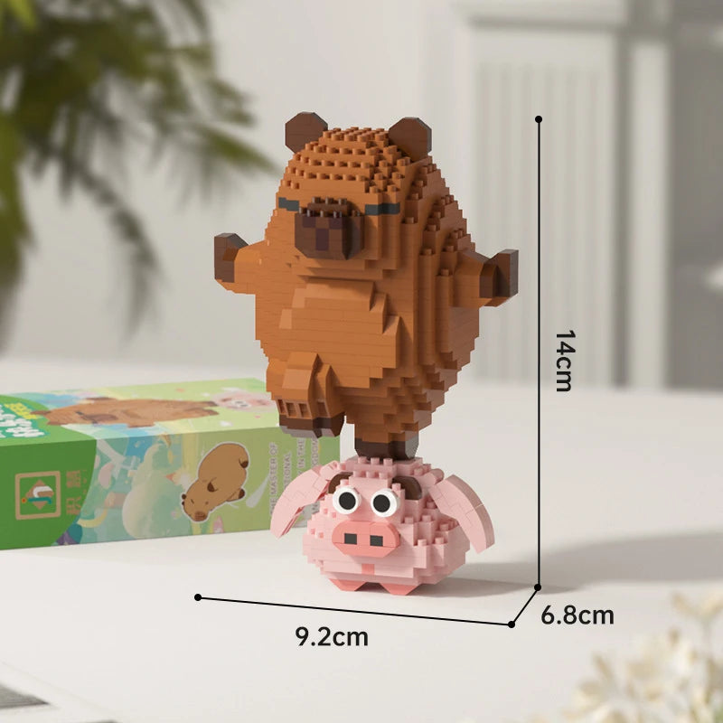 A small, detailed building block figure of a brown capybara standing on a pink base.