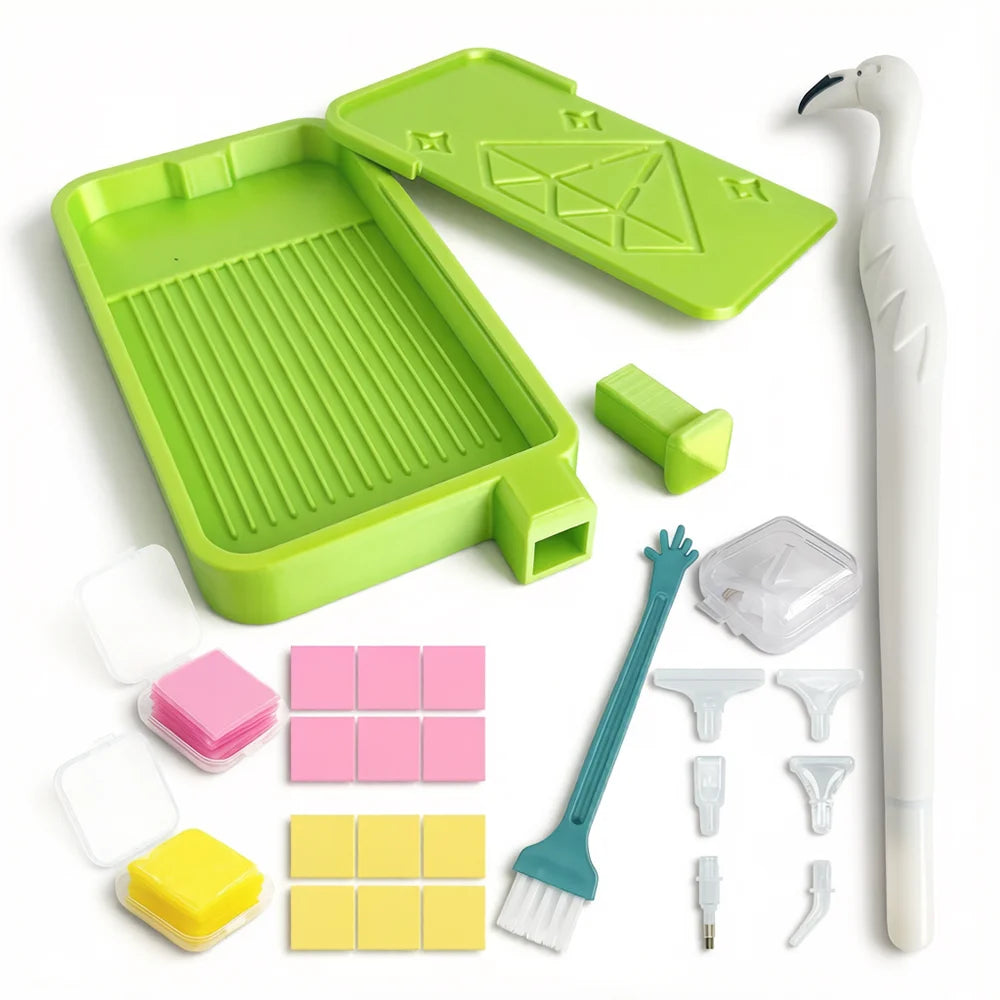 A complete diamond painting accessory kit featuring a green tray, various tools like tweezers and brushes, and iridescent til