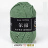 A ball of soft milk cotton yarn used for knitting and crochet