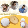 A set of white squishy toys shaped like steamed buns and packaging, including a round bun and a small egg-shaped toy.