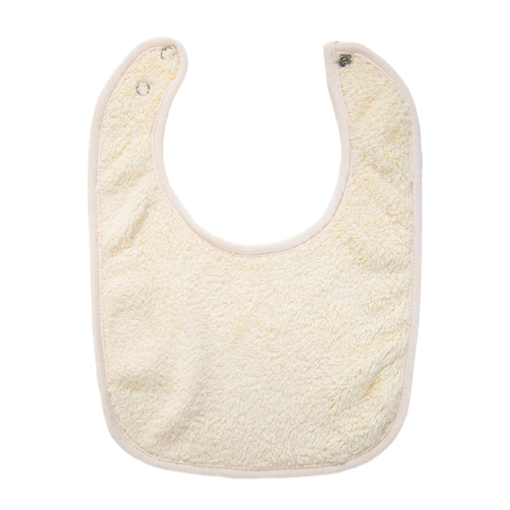 A light yellow soft cotton baby bib with a curved shape and adjustable snap closure.