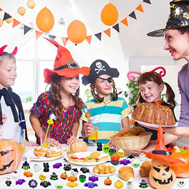 A group of children smiling while holding and interacting with various Halloween squishies and soft toys.