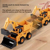 A yellow diecast excavator toy truck is shown gently pushing a car forward using inertia.