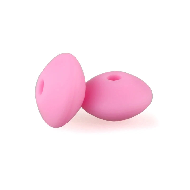 Two pink silicone lentil beads shaped like an abacus for jewelry making