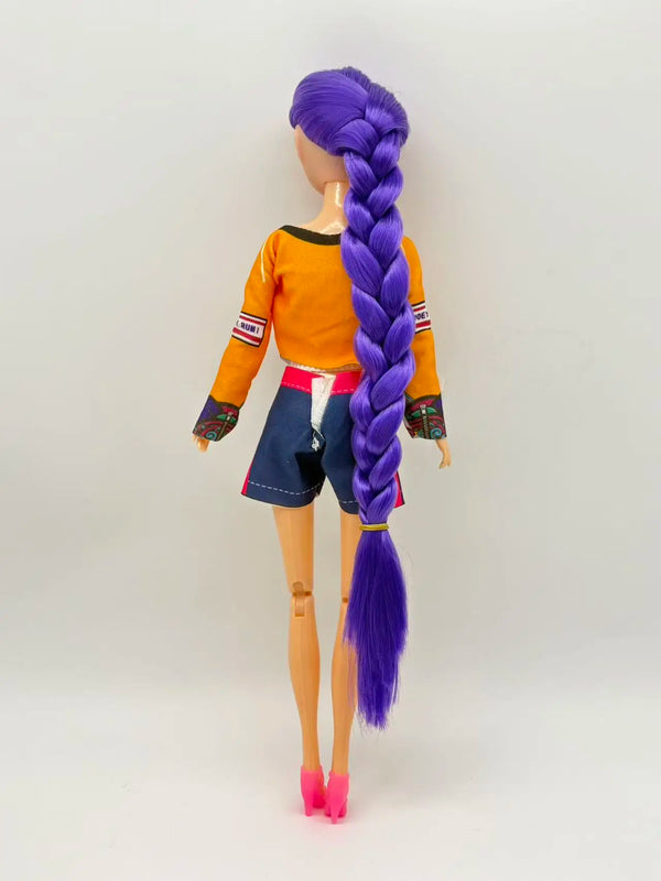 A purple-haired doll wearing an orange top and blue shorts with a purple braid.