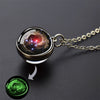 A glow-in-the-dark solar system pendant necklace featuring a miniature, colorful planetary view.