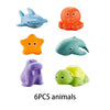 Six plastic animals including a blue turtle, an orange frog, a teal sea creature, and a purple creature.