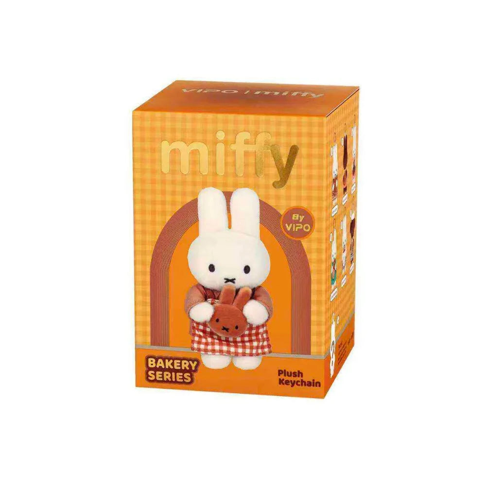 A Miffy Bakery Series blind box keychain featuring a white bunny character in an orange box.