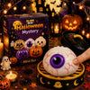 A Halloween mystery box featuring various spooky themed squishy toys and an orange pumpkin.