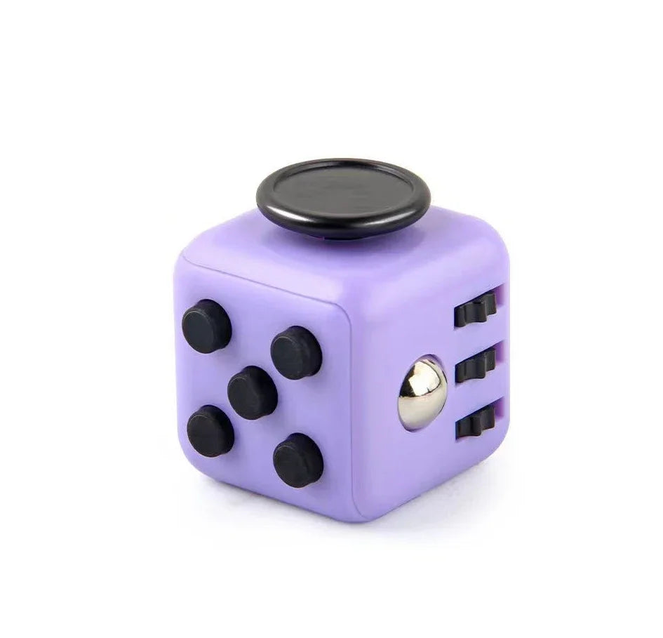A purple fidget cube with a rotating joystick and magnetic buttons.