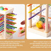 A wooden counting game featuring dice and sticks for early math learning, showing how players draw matching colors to end the