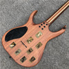 A brown electric guitar with a black pickguard and numerous camouflage tarot stickers on the body