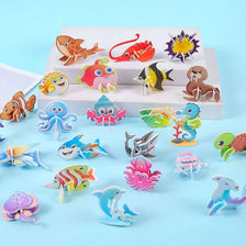 A collection of colorful 3D DIY cardboard puzzle pieces featuring various animals, dinosaurs, insects, and vehicles arranged 