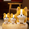 A plush toy of a Corgi dog with yellow and white fur sitting on a woven surface.