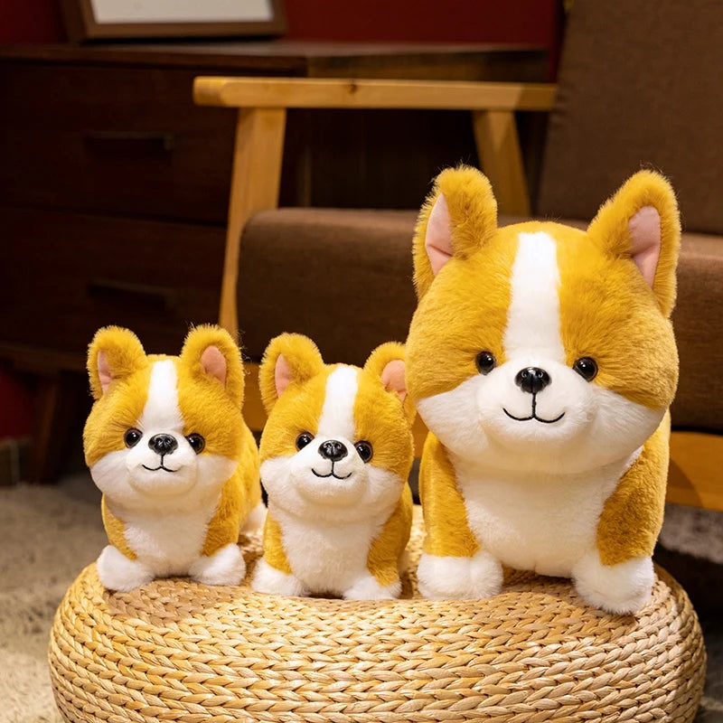 A plush toy of a Corgi dog with yellow and white fur sitting on a woven surface.