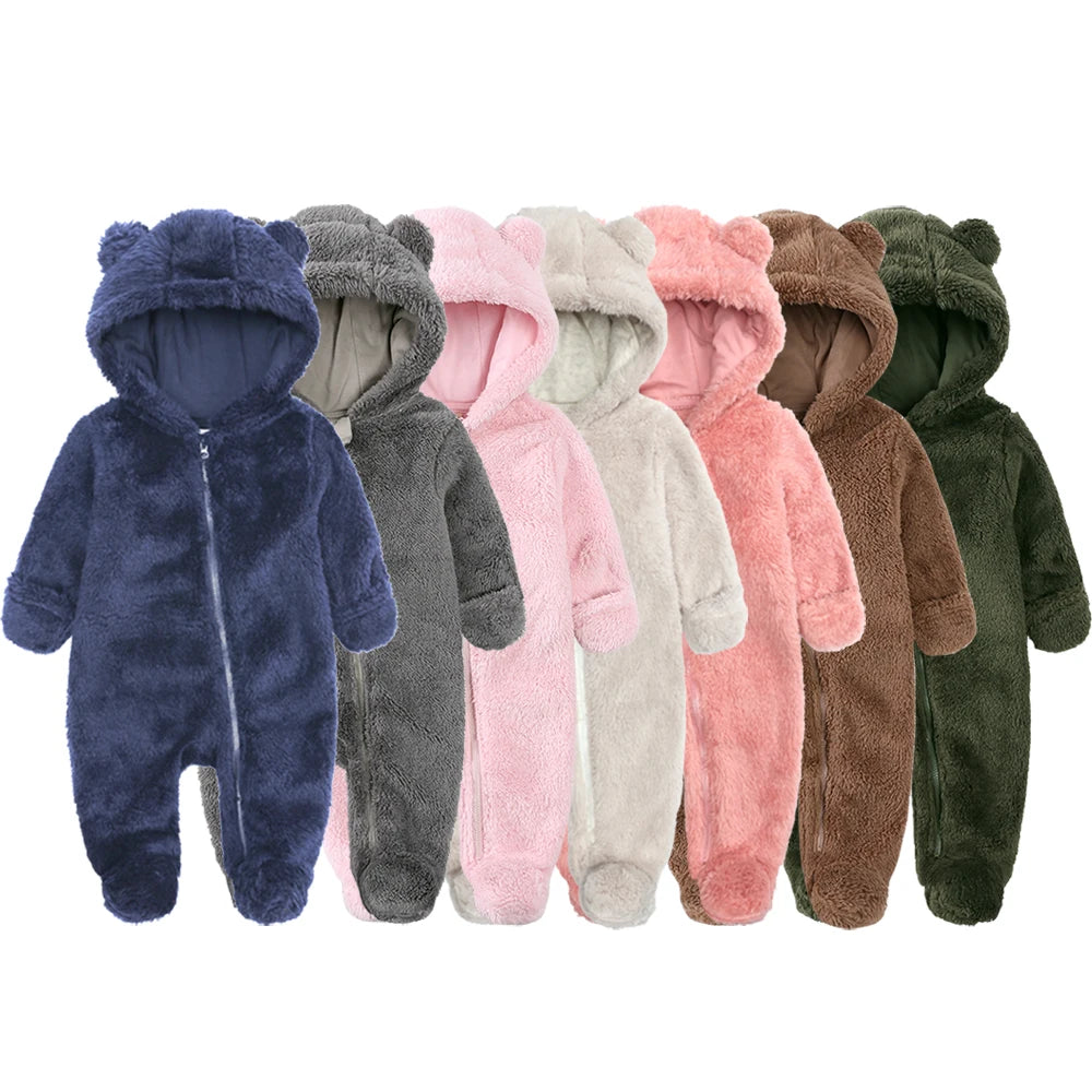 A row of baby bear fleece hooded rompers in various colors including blue, gray, pink, beige, and brown.