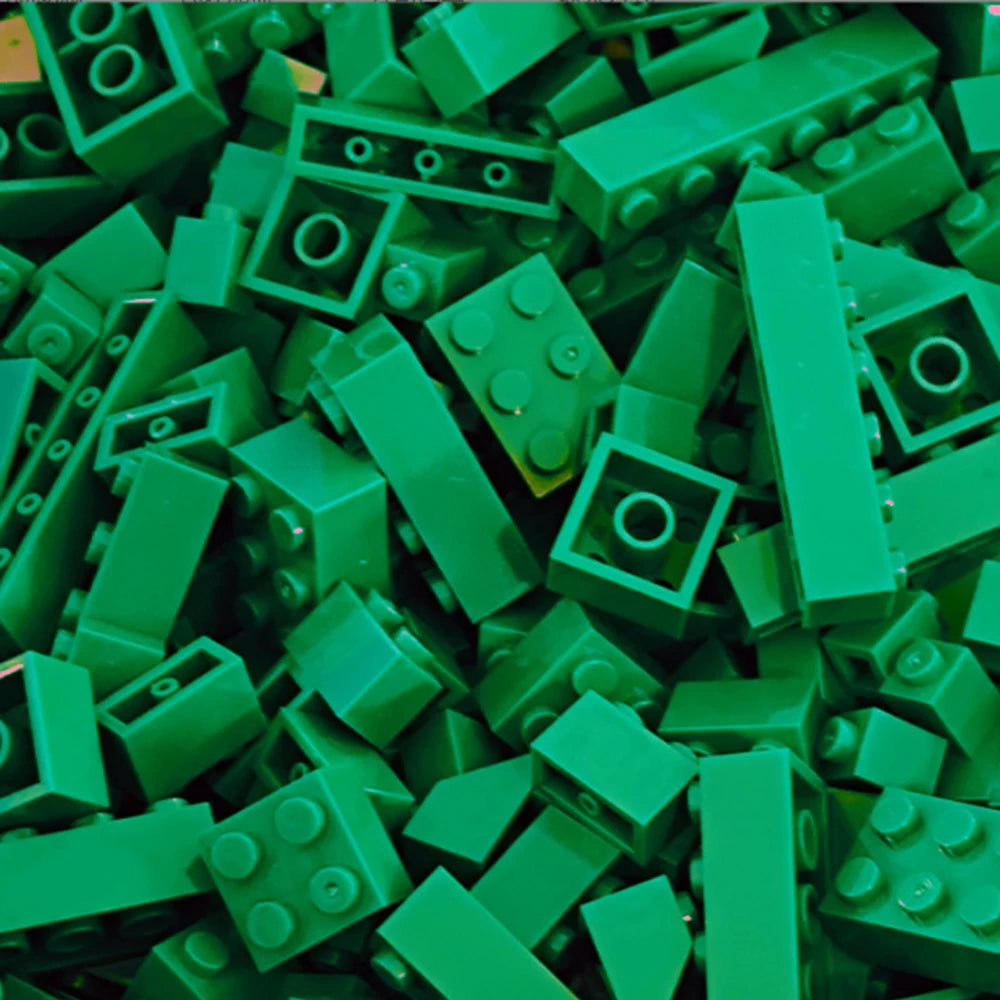 A pile of green building blocks used for creative DIY projects.