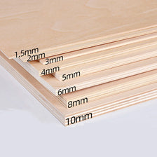 A stack of light-colored basswood craft sheets showing various thicknesses from 1.5mm to 10mm.