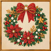 A festive Christmas wreath made of green foliage, red berries, gold accents, and a large red bow with white pearl embellishme