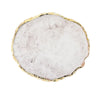 A round slab of white and gray resin with gold trim, used for nail art.