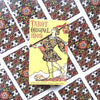 A yellow tarot card titled Tarot Original 1909 featuring a figure in historical attire against a patterned background.