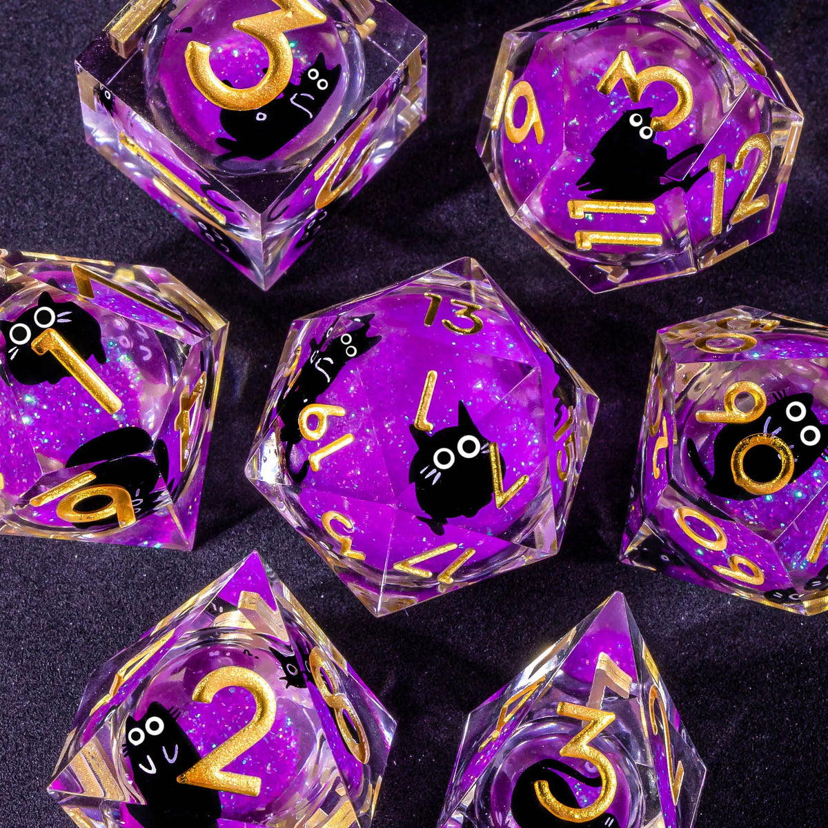 A set of handmade liquid core resin dice featuring purple and gold colors with sharp edges.