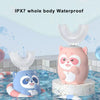Pink and blue U-shaped electric toothbrush with a cat face design sitting on a stand.
